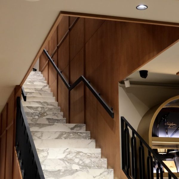 a set of stairs leading up to a living room